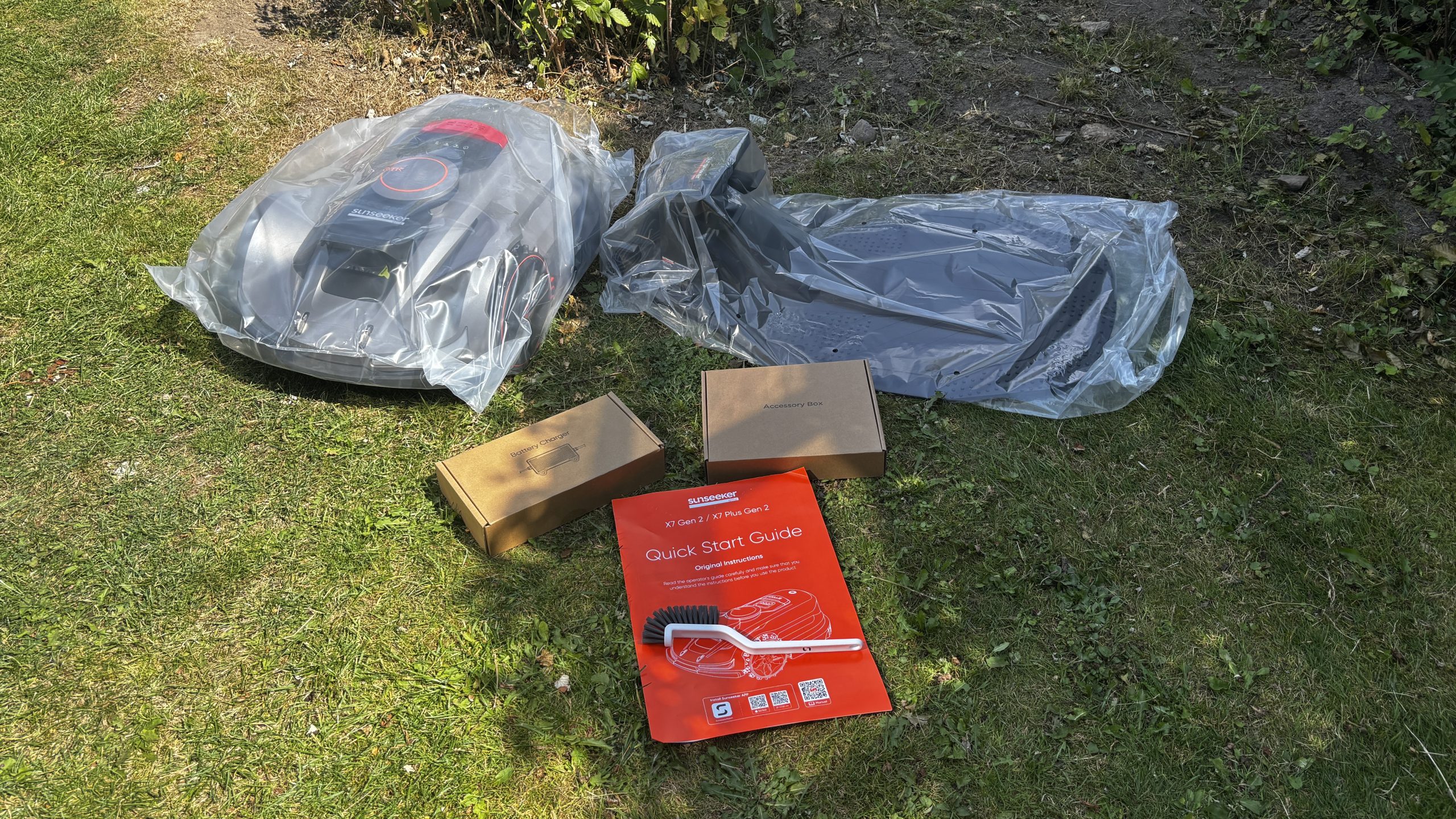 Sunseeker X7 Gen2 med ladestation, tilbehør og quick start guide
