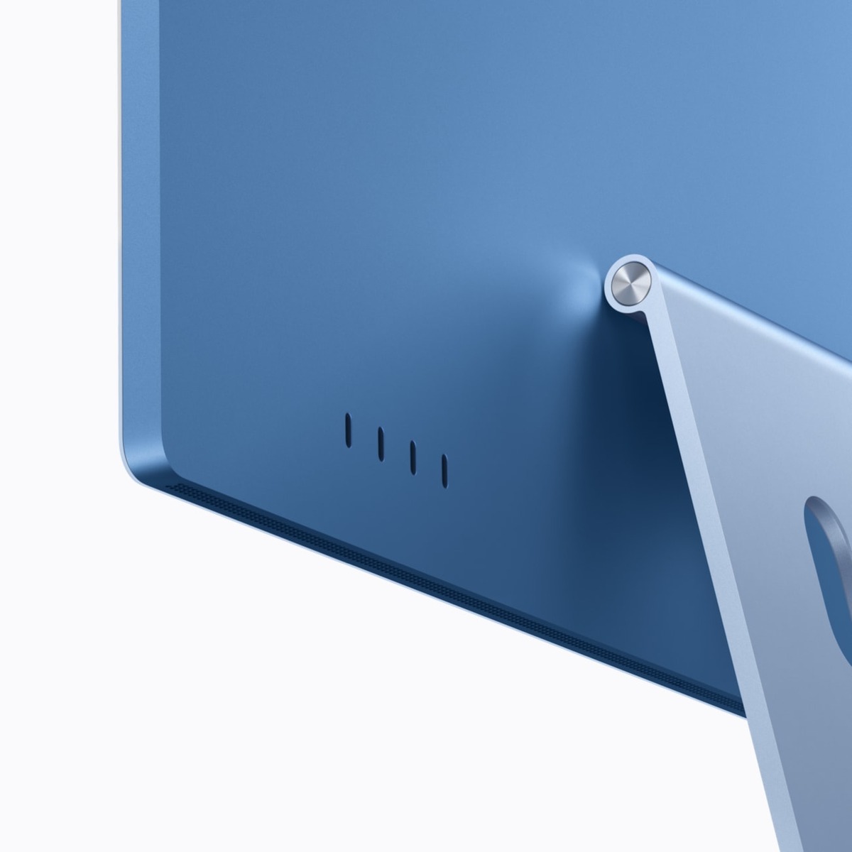 Nærbillede af fire Thunderbolt 4-porte på bagsiden af en blå iMac med M6.